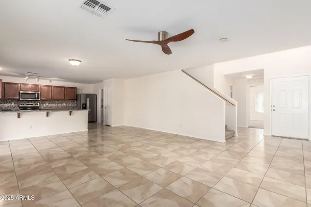 a view of a kitchen with a sink and cabinets