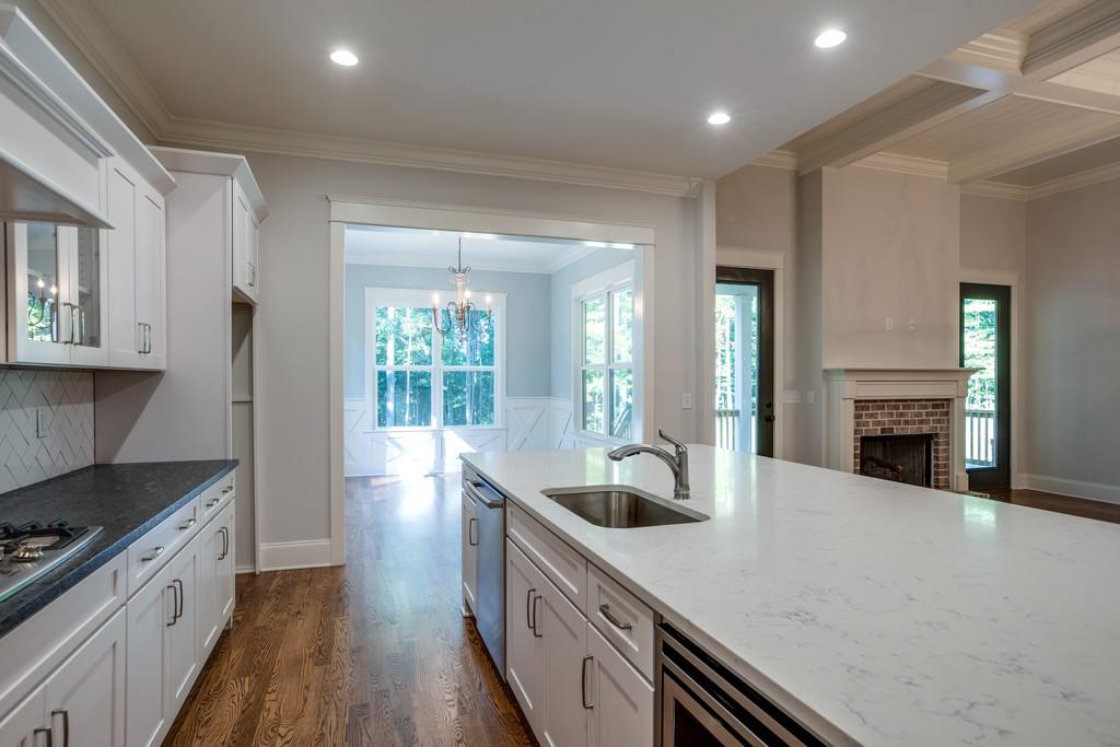 5908 Pinewood Road Franklin, TN 37064 - Photo 14 of 30 a kitchen with counter top space and wooden floor