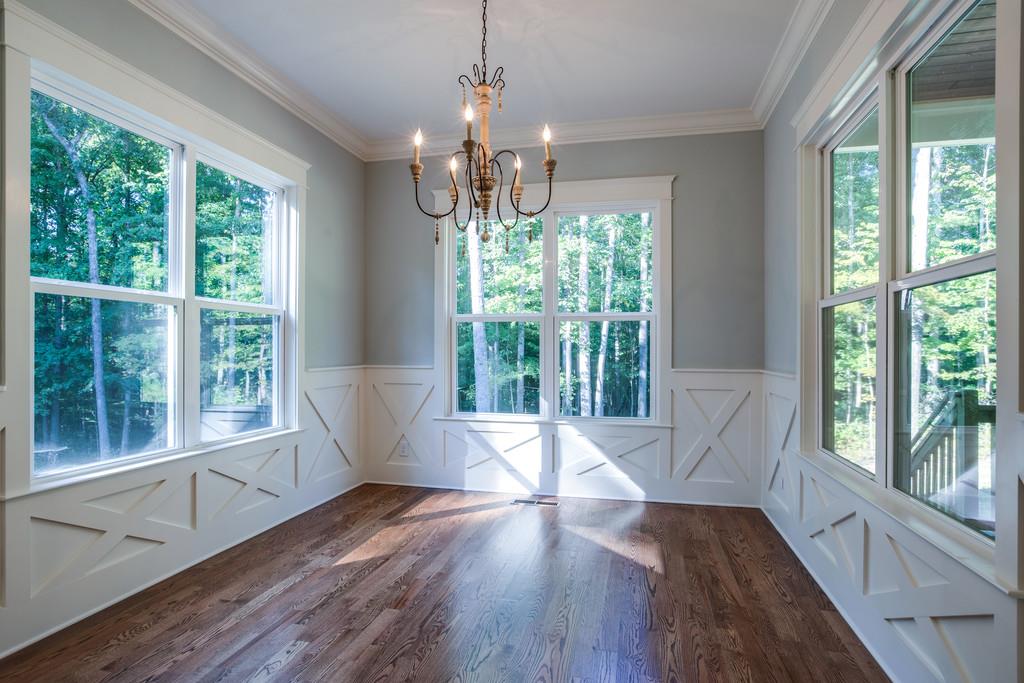 5908 Pinewood Road Franklin, TN 37064 - Photo 15 of 30 a view of an empty room with wooden floor and a large window