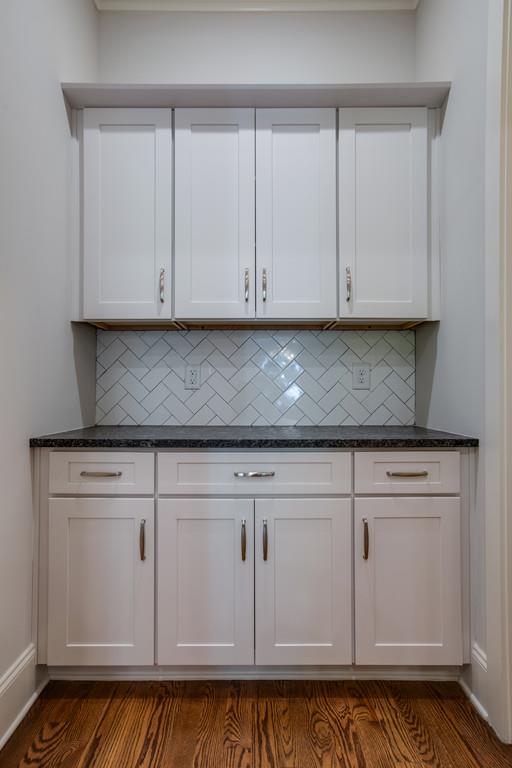 5908 Pinewood Road Franklin, TN 37064 - Photo 17 of 30 a kitchen with granite countertop white cabinets and a sink