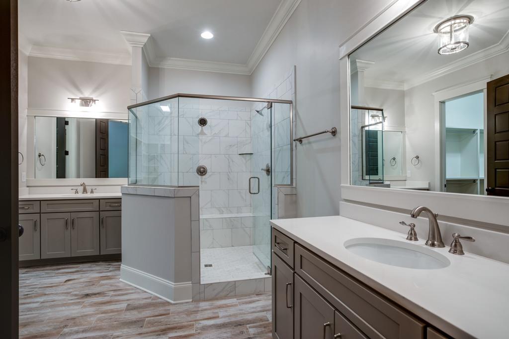 5908 Pinewood Road Franklin, TN 37064 - Photo 19 of 30 a bathroom with a granite countertop sink mirror and shower