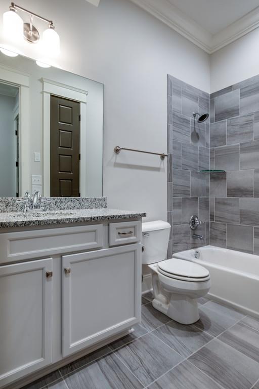 5908 Pinewood Road Franklin, TN 37064 - Photo 21 of 30 a bathroom with a sink a toilet and shower