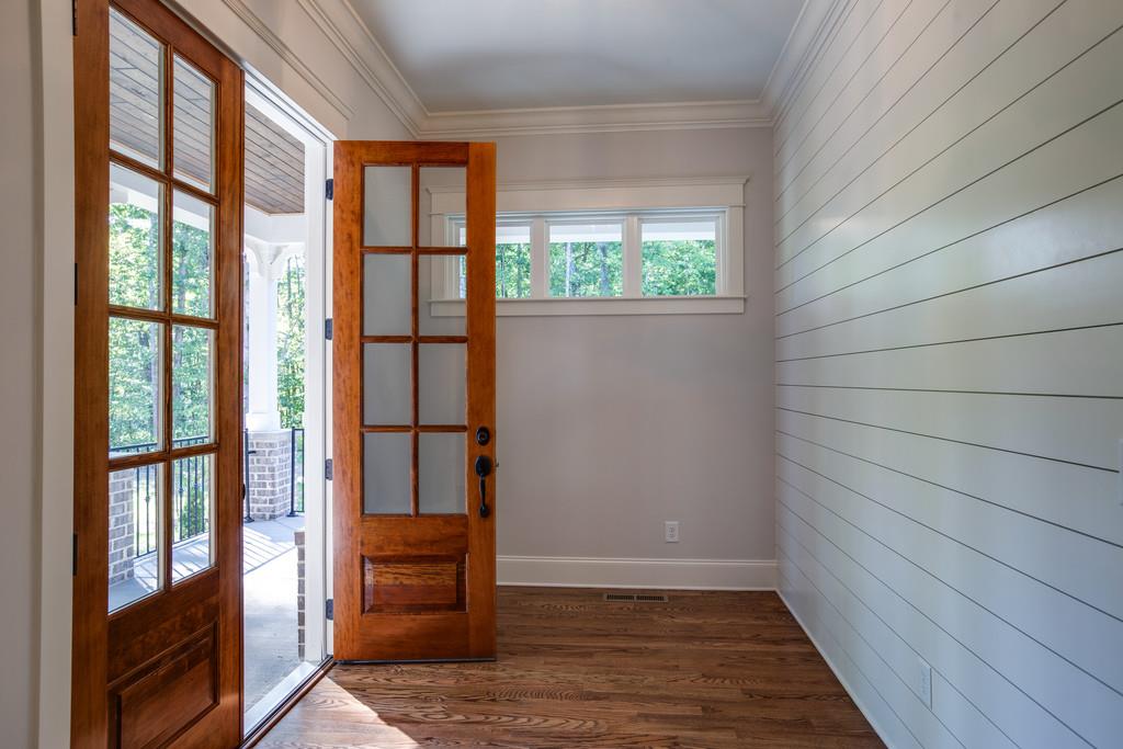 5908 Pinewood Road Franklin, TN 37064 - Photo 4 of 30 a view of empty room with wooden floor and fan