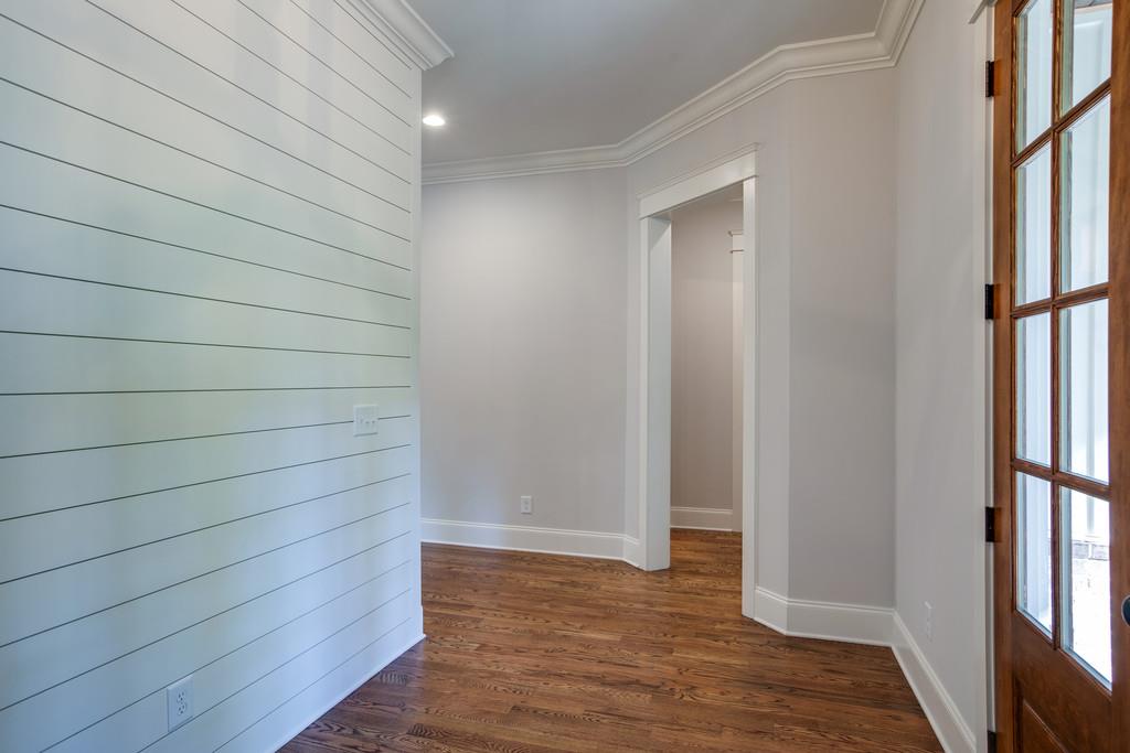 5908 Pinewood Road Franklin, TN 37064 - Photo 5 of 30 a view of empty room with wooden floor and fan