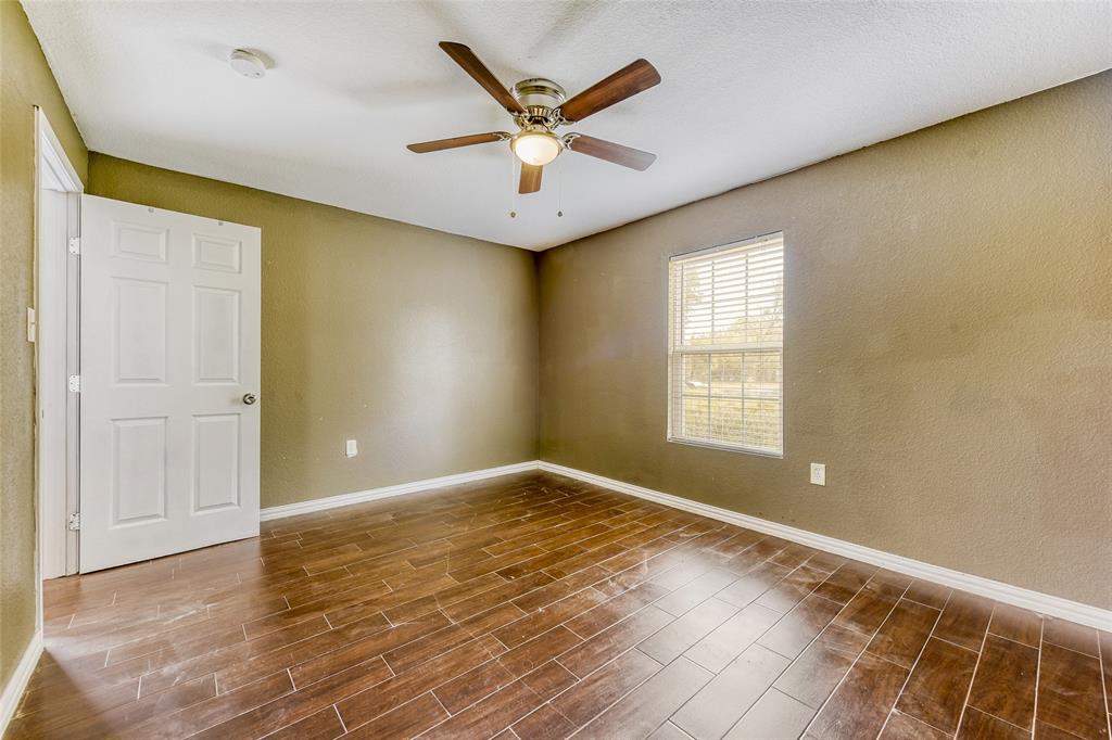 11350 County Road 377 Terrell, TX 75161 - Photo 11 of 24 wooden floor in an empty room with a window