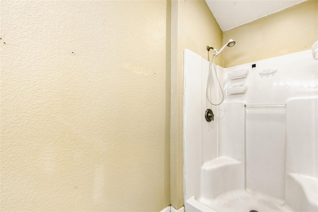 11350 County Road 377 Terrell, TX 75161 - Photo 16 of 24 a bathroom with a shower and toilet