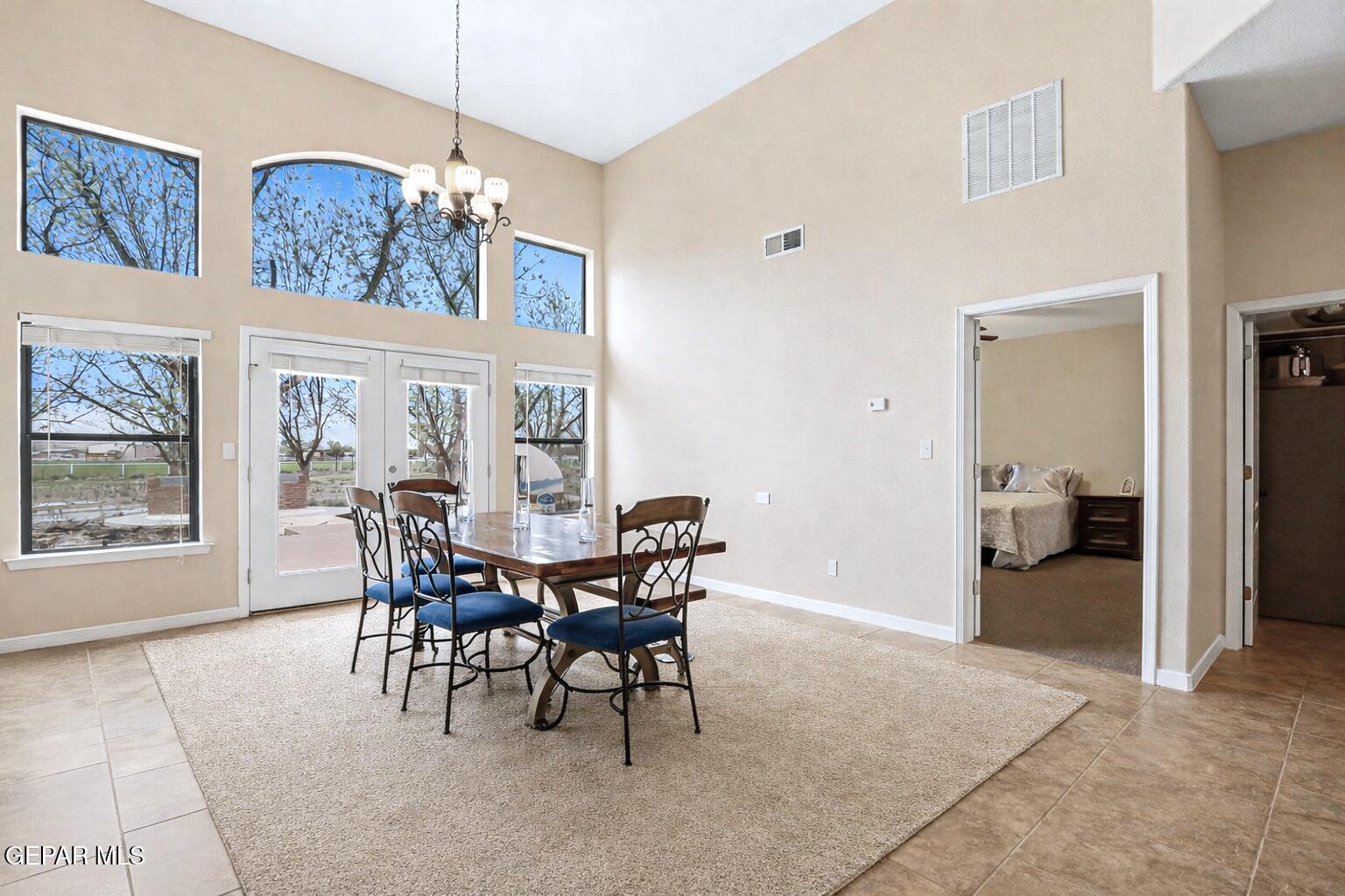 617 Wallace Road Anthony, NM 88021 - Photo 23 of 65 a view of a dining room with furniture and chandelier
