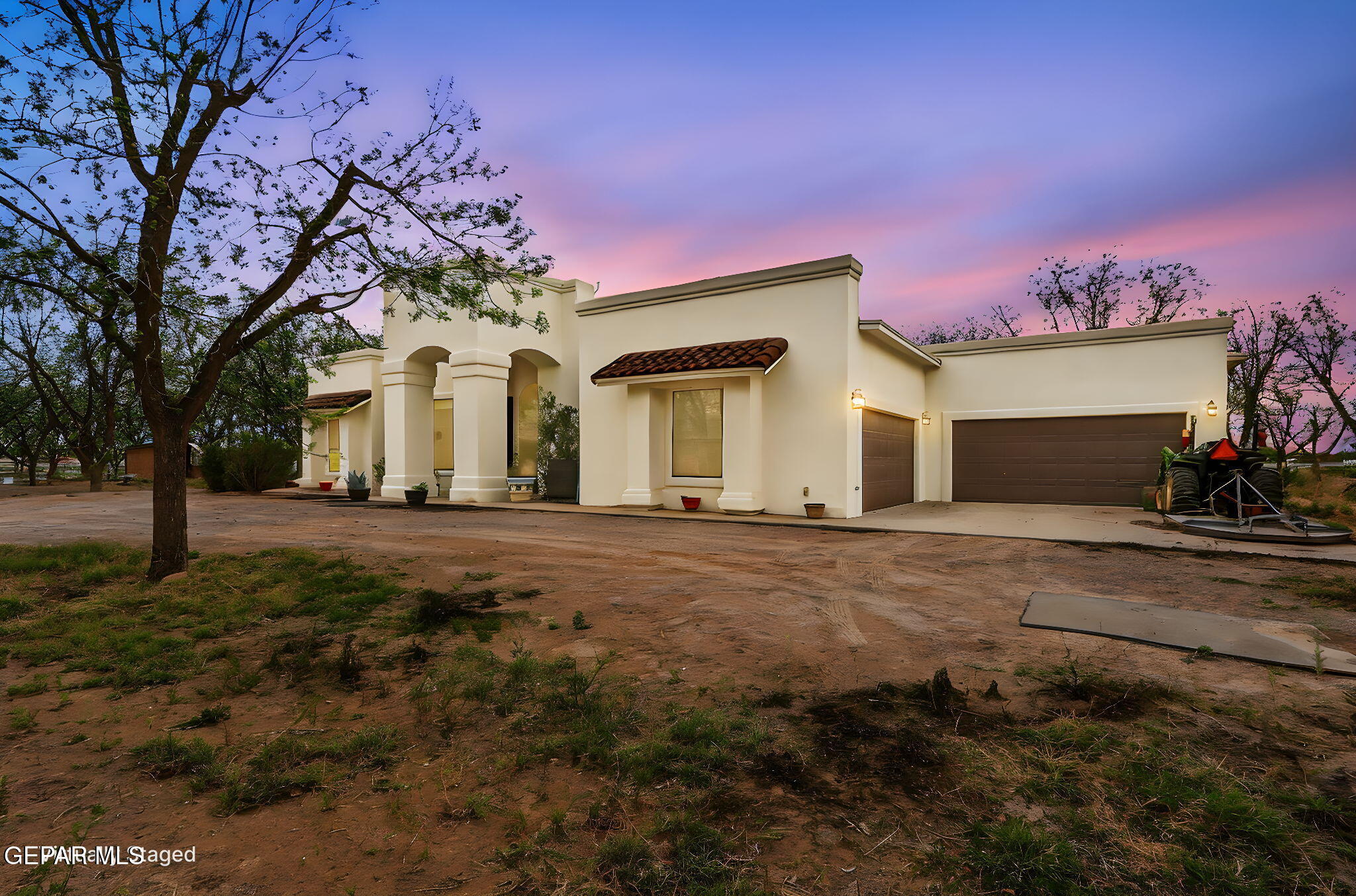 617 Wallace Road Anthony, NM 88021 - Photo 3 of 65 a front view of a house with a yard and garage