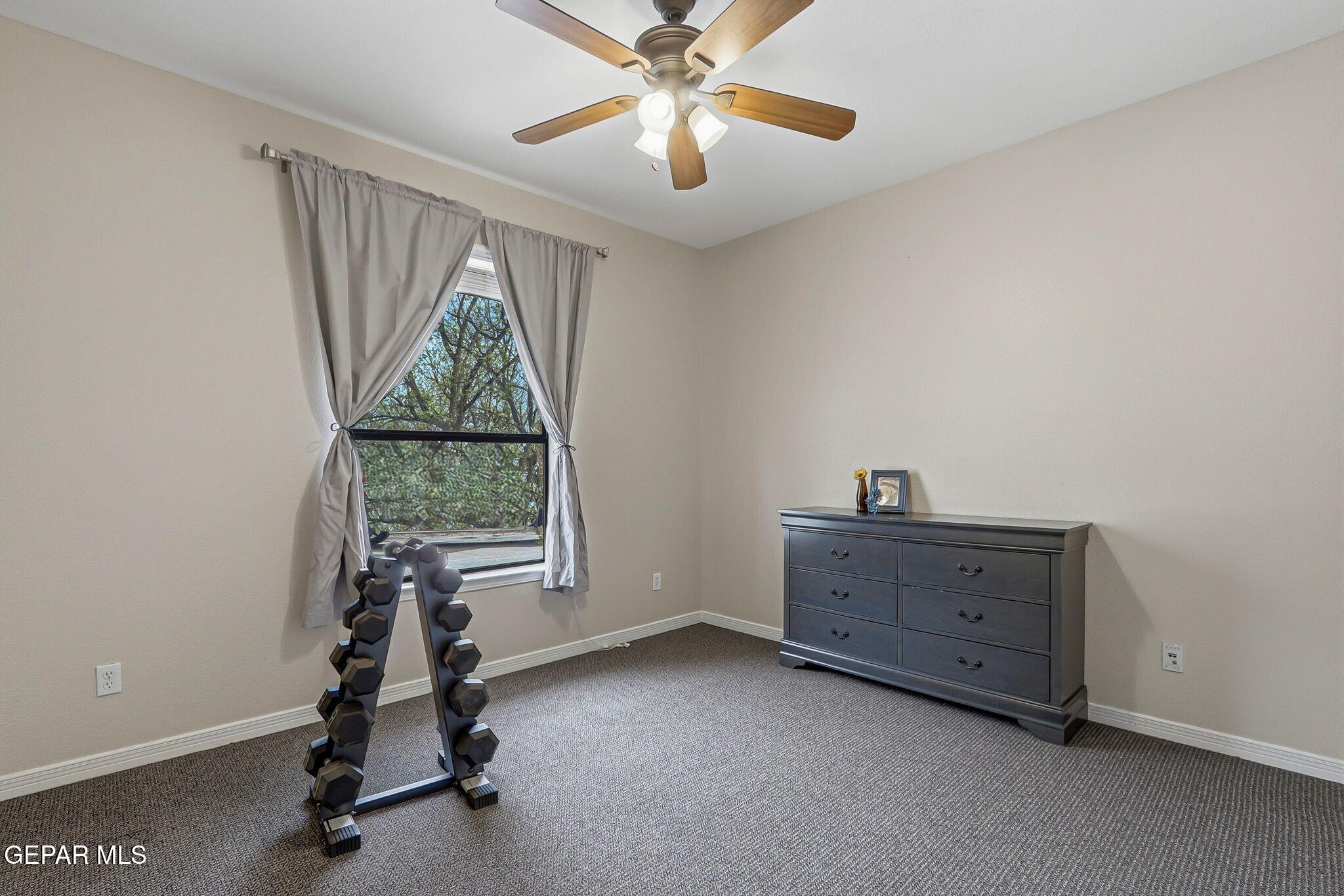 617 Wallace Road Anthony, NM 88021 - Photo 36 of 65 a view of room with window and ceiling fan