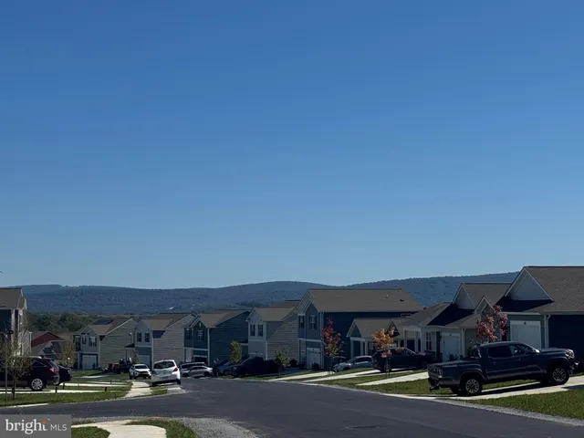 a view of street with parked cars