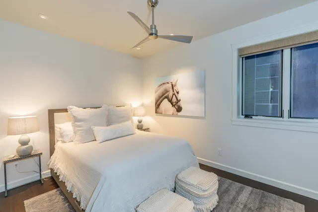 a bedroom with bed and a window