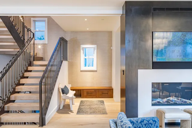 a view of an entryway with wooden floor