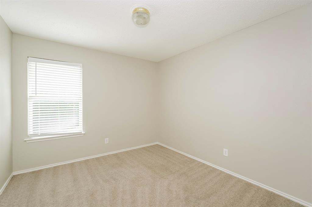 2553 Big Spring Drive Fort Worth, TX 76120 - Photo 12 of 15 an empty room with a window
