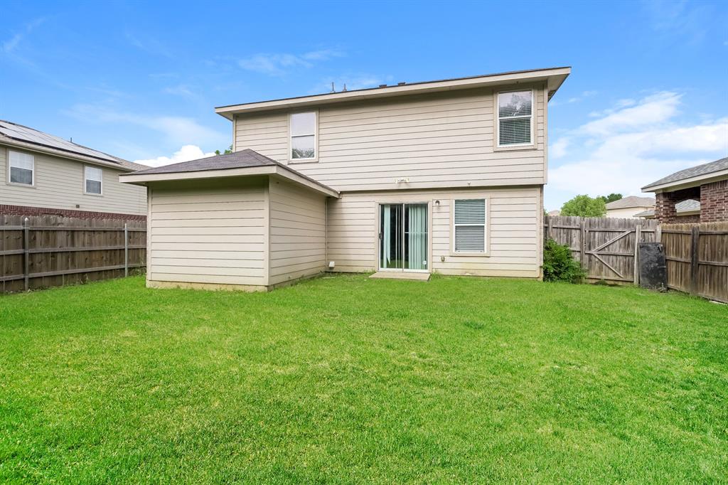 2553 Big Spring Drive Fort Worth, TX 76120 - Photo 15 of 15 a front view of a house with a garden