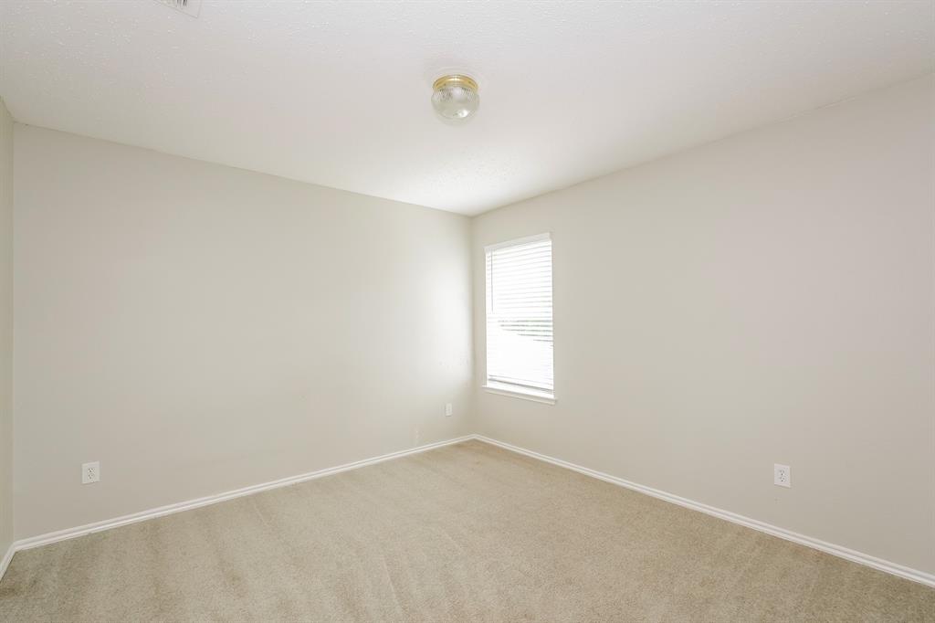 2553 Big Spring Drive Fort Worth, TX 76120 - Photo 10 of 15 a view of an empty room with a window