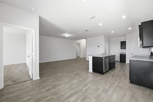 a large room with kitchen view