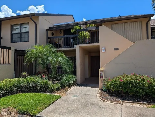 a view of a house with a yard and plants