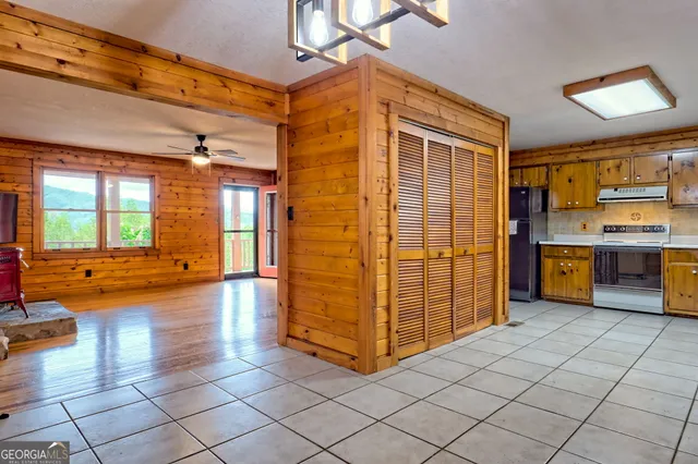 a kitchen with stainless steel appliances granite countertop a sink and cabinets