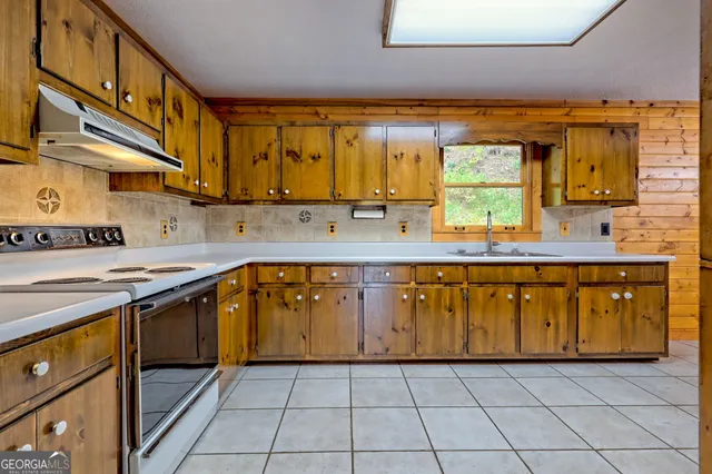 wooden floor in an empty room with a fireplace
