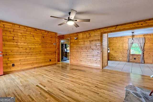 a bathroom with a sink a toilet and shower curtain