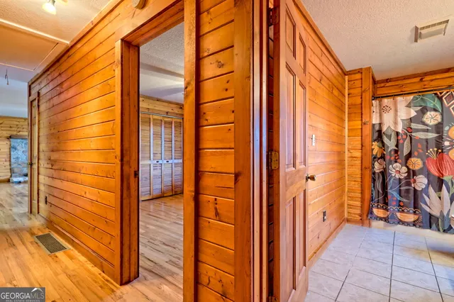 wooden floor in an empty room with a fireplace