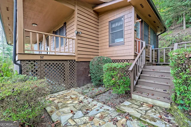 a view of a house with a small yard