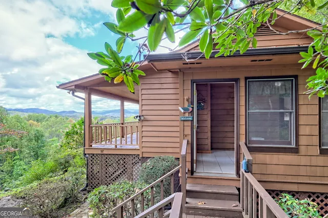a view of room with a ceiling fan and window