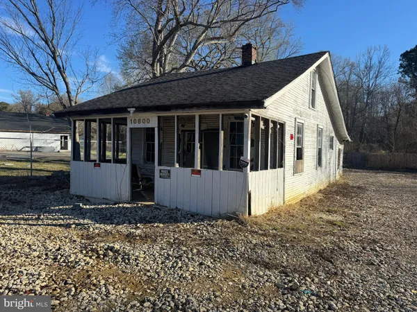 a front view of a house with a fence