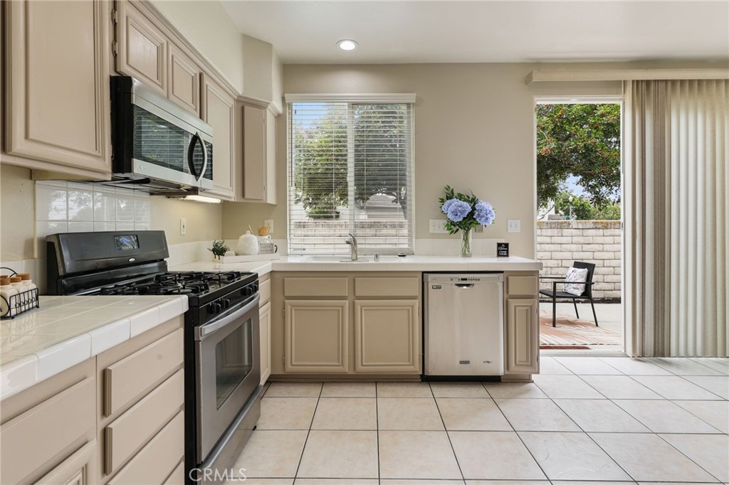 1263 Date Palm Drive Carson, CA 90746 - Photo 13 of 41 a kitchen with a sink stove and microwave