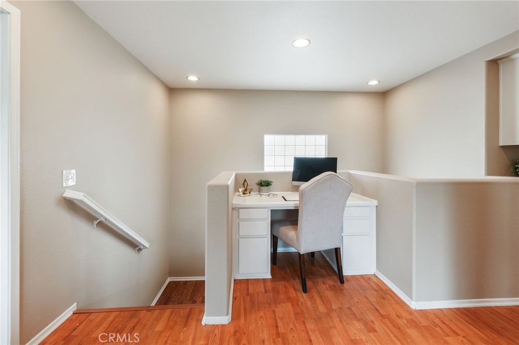1263 Date Palm Drive Carson, CA 90746 - Photo 22 of 41 a view of a workspace with furniture and wooden floor
