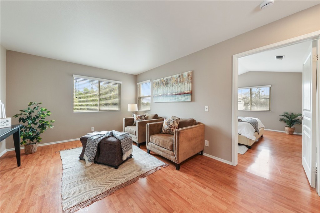 1263 Date Palm Drive Carson, CA 90746 - Photo 23 of 41 a living room with furniture and a wooden floor
