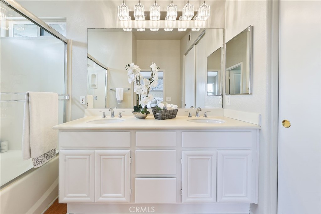 1263 Date Palm Drive Carson, CA 90746 - Photo 26 of 41 a bathroom with a sink vanity a mirror and a shower