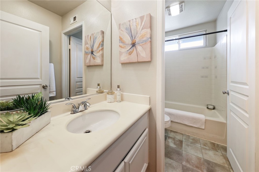 1263 Date Palm Drive Carson, CA 90746 - Photo 34 of 41 a bathroom with a sink a mirror and a shower