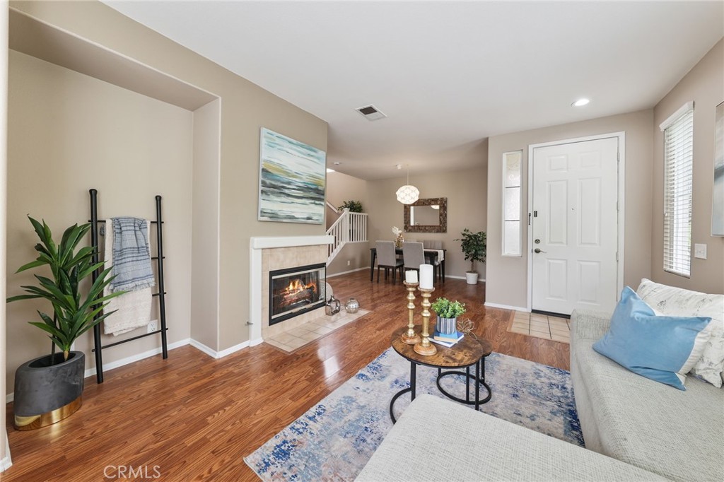 1263 Date Palm Drive Carson, CA 90746 - Photo 7 of 41 a living room with furniture a wooden floor and a fireplace