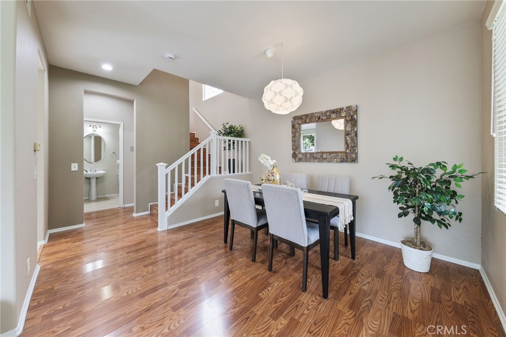 1263 Date Palm Drive Carson, CA 90746 - Photo 10 of 41 a view of a dining room with furniture and wooden floor