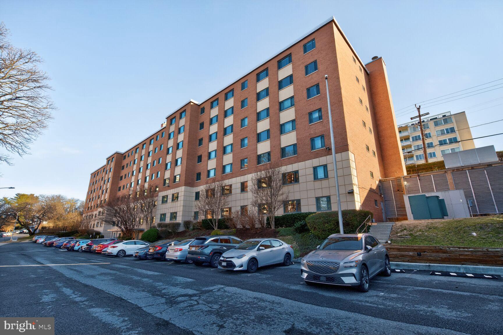 1200 South Arlington Ridge Road, Unit 504 Arlington, VA 22202 - Photo 2 of 15 Modern brick apartment building with ample park...