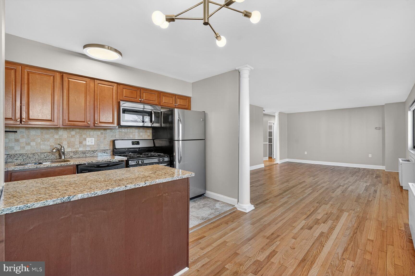 1200 South Arlington Ridge Road, Unit 504 Arlington, VA 22202 - Photo 3 of 15 Modern kitchen meets spacious living area.