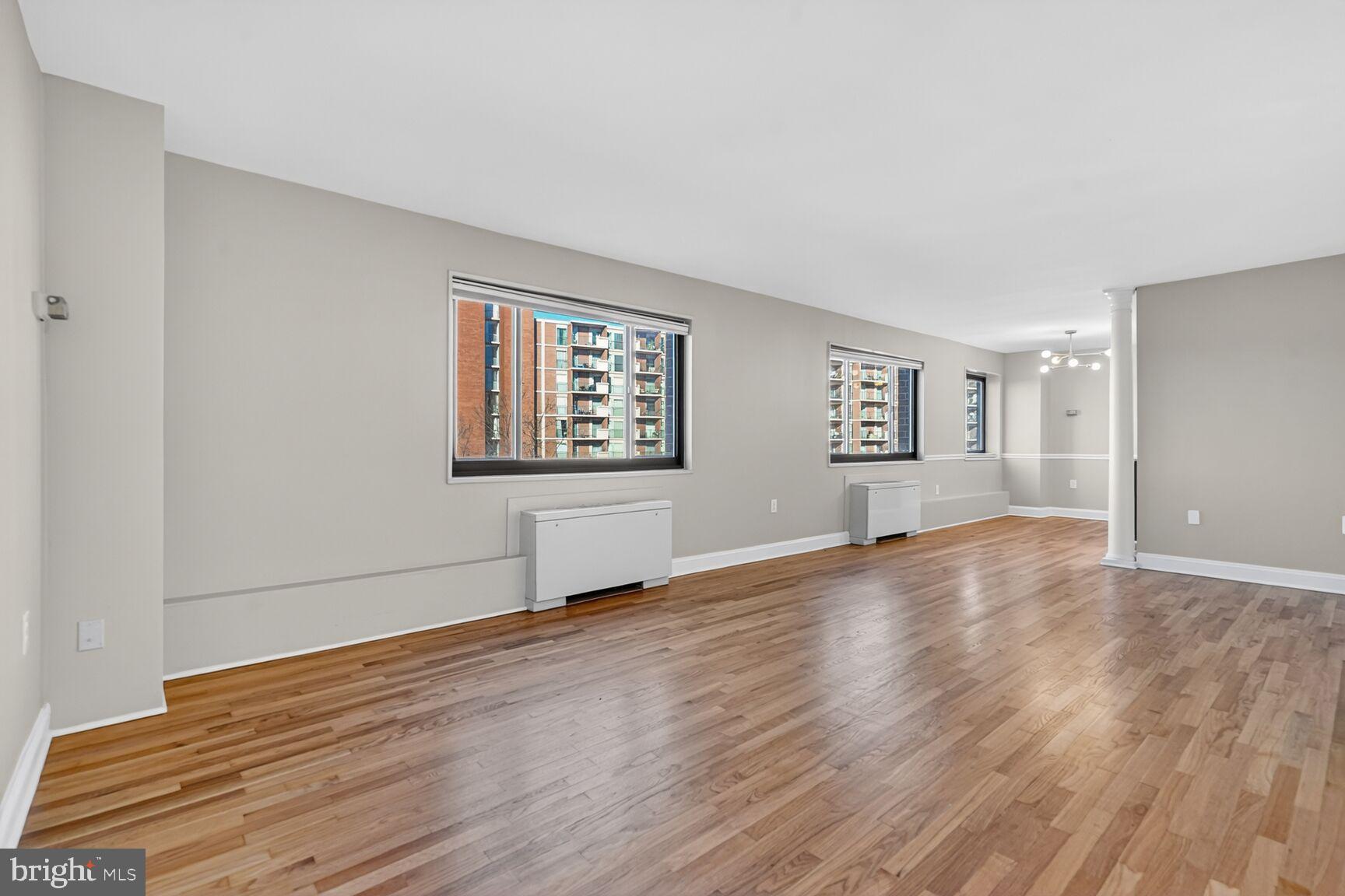 1200 South Arlington Ridge Road, Unit 504 Arlington, VA 22202 - Photo 5 of 15 Spacious, sunlit room with urban views.