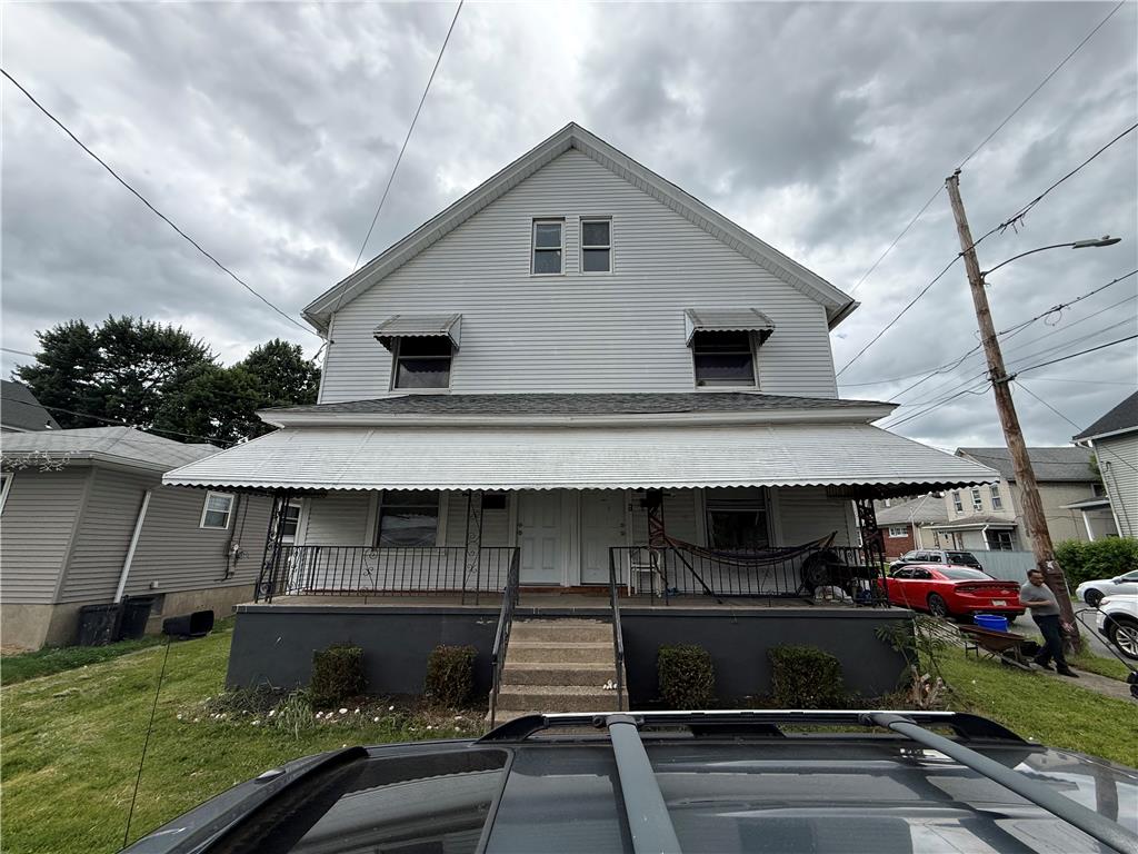 700 Philo Street Scranton, PA 18508 - Photo 2 of 19 A classic two-story residence with a charming covered front porch, perfect for enjoying peaceful afternoons.