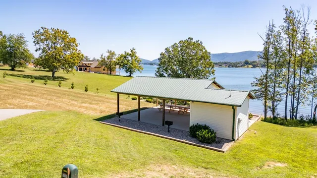 a view of swimming pool with a yard