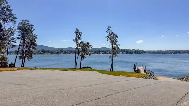 a swimming pool with an outdoor space and seating area