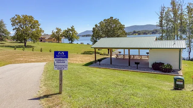 a view of a house with backyard porch and sitting area