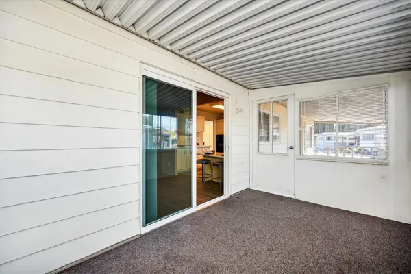 a view of an empty room and window