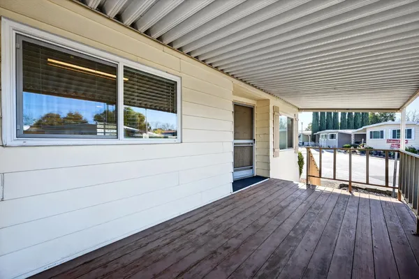 a view of a house with porch and wooden floor