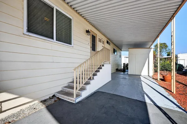 a view of a backyard with sitting area