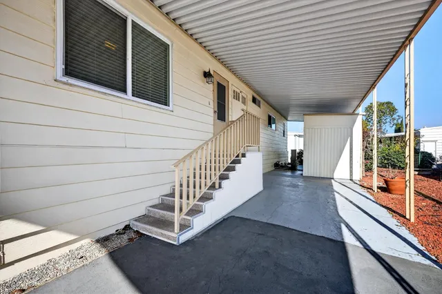 a view of a backyard with sitting area