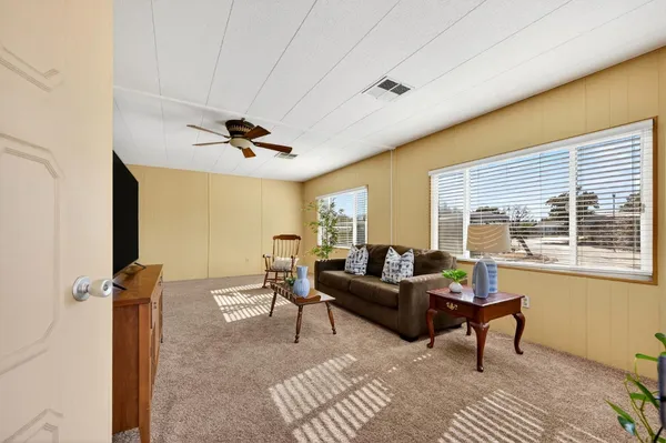 a living room with furniture and a window