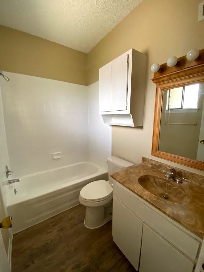 3316 Guadalupe Street, Unit 212 Austin, TX 78705 - Photo 11 of 22 a bathroom with a sink toilet and bathtub