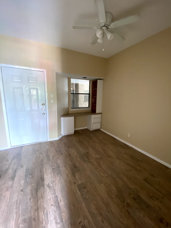 3316 Guadalupe Street, Unit 212 Austin, TX 78705 - Photo 13 of 22 wooden floor in an empty room with a window