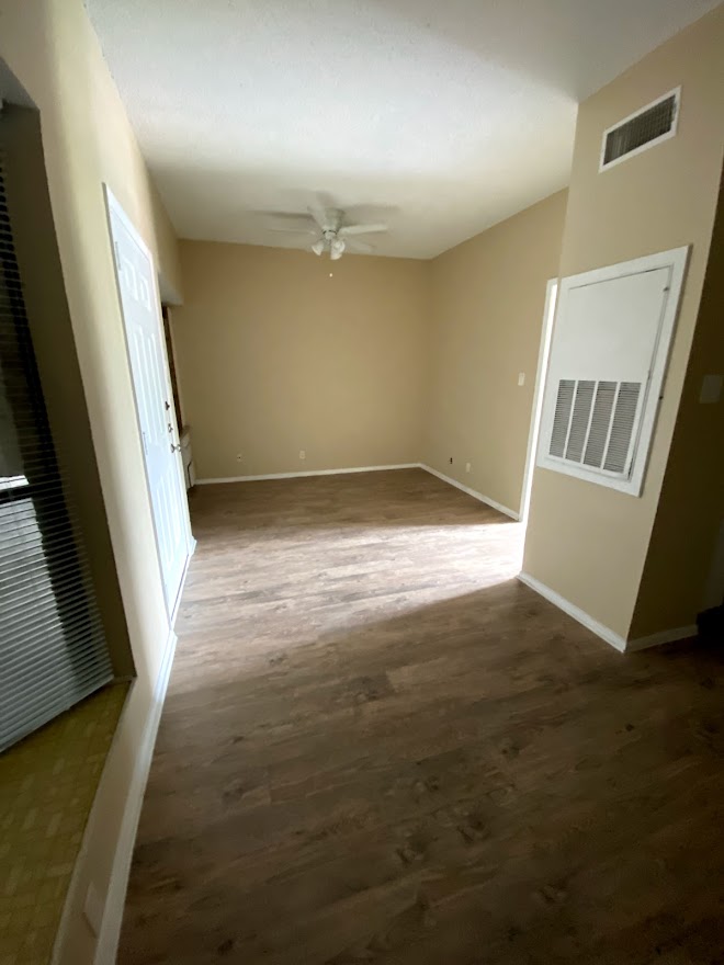 3316 Guadalupe Street, Unit 212 Austin, TX 78705 - Photo 3 of 22 a view of an empty room and wooden floor